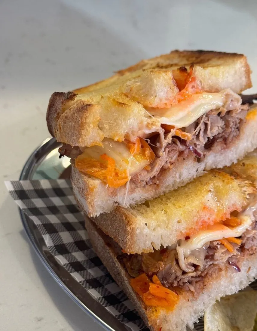 Slow-cooked brisket and kimchi toastie, cut and stacked